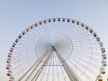Low angle view of giant ferris wheel against clear sky