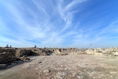 Old ruins at amman citadel against sky