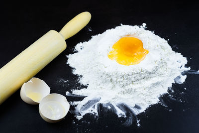 High angle view of breakfast on table against black background
