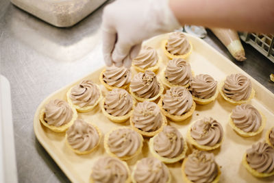Close-up of hand holding cake