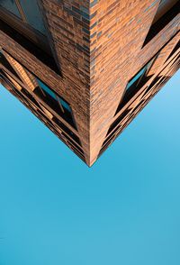 Low angle view of building against clear blue sky