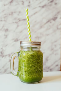 Close-up of drink in glass jar on table