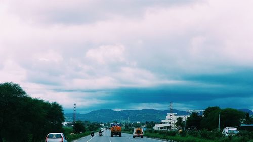 Road against cloudy sky