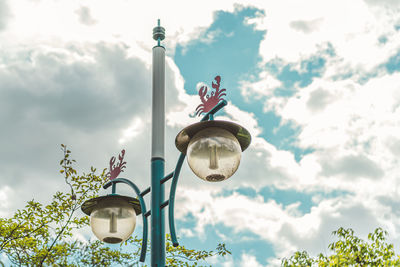 Low angle view of street light against sky