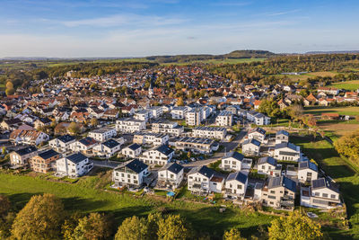 Germany, baden-wurttemberg, waiblingen, aerial view of modern energy efficient suburb in autumn