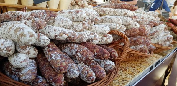 High angle view of variety of sausages presented in farmers market