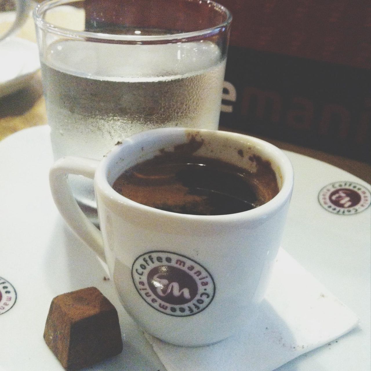 drink, coffee cup, refreshment, food and drink, indoors, coffee - drink, table, saucer, still life, freshness, close-up, coffee, cup, frothy drink, tea cup, focus on foreground, no people, beverage, cappuccino, high angle view