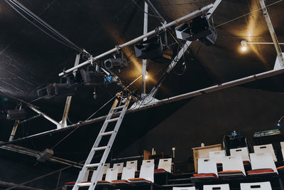 Low angle view of illuminated ferris wheel at night
