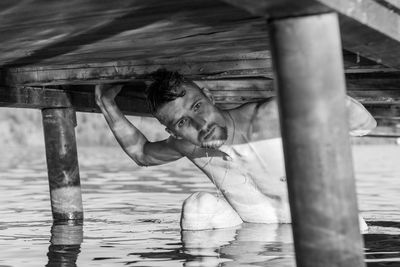 Portrait of boy looking at water