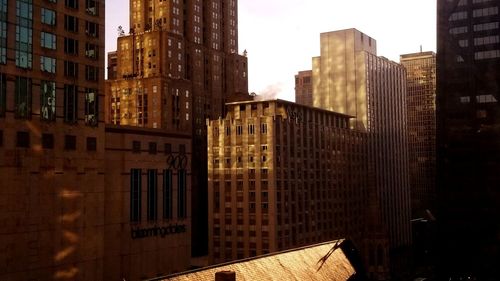 Buildings in city against sky