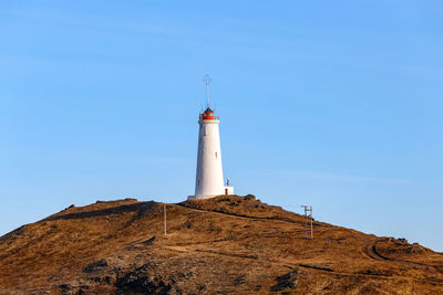 Low angle view of lighthouse against sky