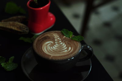 Close-up of cappuccino on table