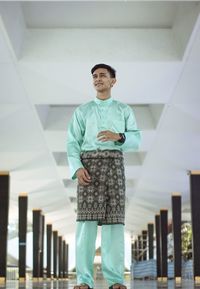 Low angle view of man standing against building
