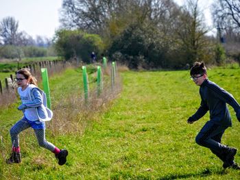 Full length of a girl running in park