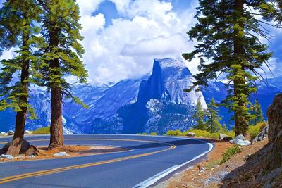 Scenic view of mountains against blue sky