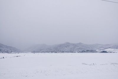 Scenic view of snow covered mountains