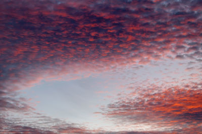 Low angle view of clouds in sky during sunset