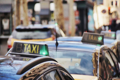 Close-up of taxi car on street