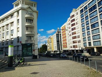 Buildings in city against sky