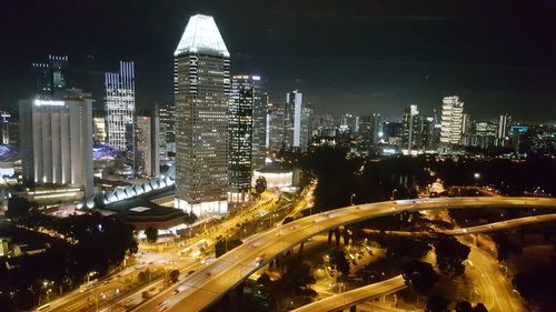 Aerial view of city lit up at night