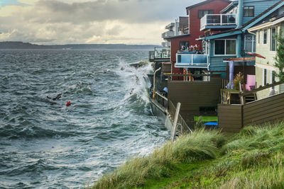 Stormy ocean weather hits homes in west seattle, washington.