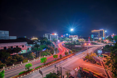 High angle view of light trails on city street at night