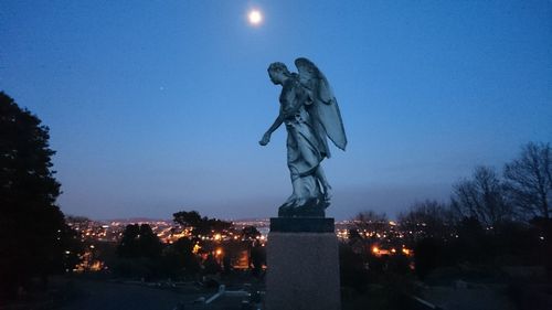 Statue of liberty against sky at dusk