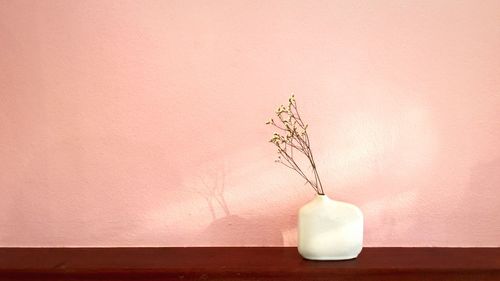 Flower vase on table