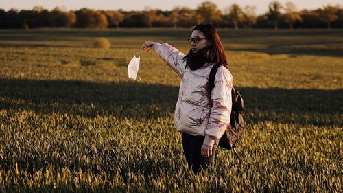 Woman standing on field