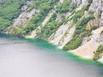 High angle view of river flowing through rocks