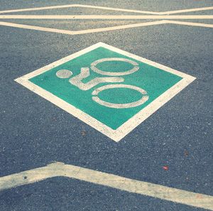 High angle view of arrow sign on road