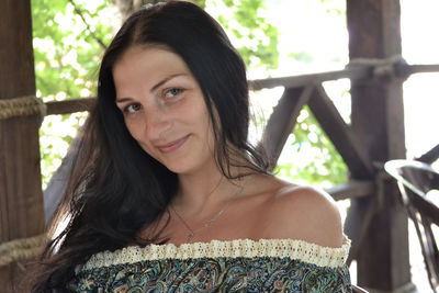 Portrait of a smiling young woman outdoors