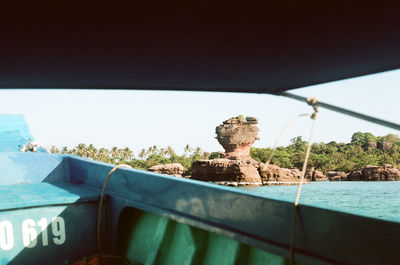 Close-up of boat against clear blue sky