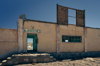 Low angle view of old building against clear sky