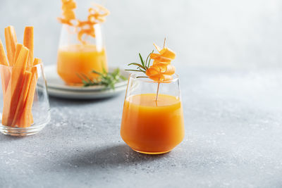 Close-up of orange juice on table