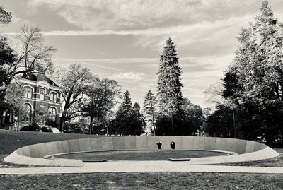 Fountain in park against sky