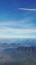 Scenic view of landscape against blue sky