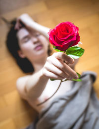 Close-up of woman holding rose