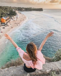 Rear view of woman at beach