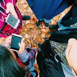 High angle view of people photographing with mobile phone