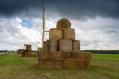 Tractor from straw bales in the field