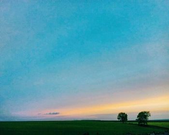 Scenic view of landscape against sky at dusk