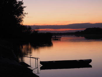 Scenic view of lake at sunset