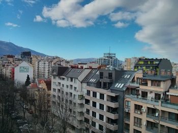 Buildings and street against sky