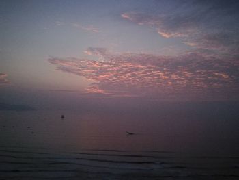 Scenic view of sea against sky at sunset