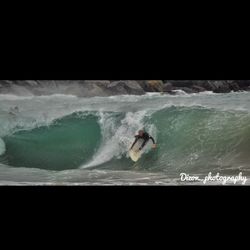 People surfing in sea