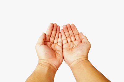 Close-up of hand against white background