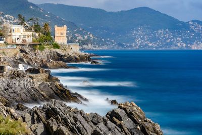 Panoramic view of sea and buildings against sky