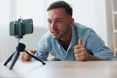 Portrait of man using mobile phone