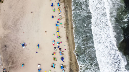 Aerial view of people enjoying at beach